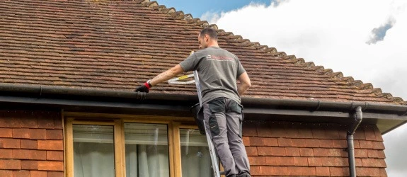 our team cleaning the gutters on a house in Leicester